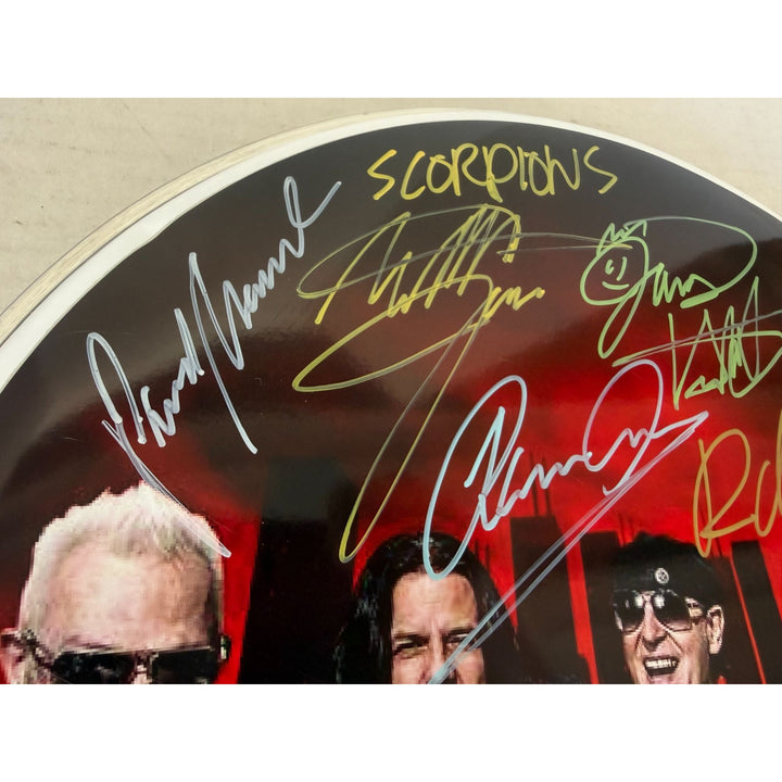 Scorpions Klaus Maine, Rudolf Schenker, Pawel Maciwoda drumhead signed with proof.