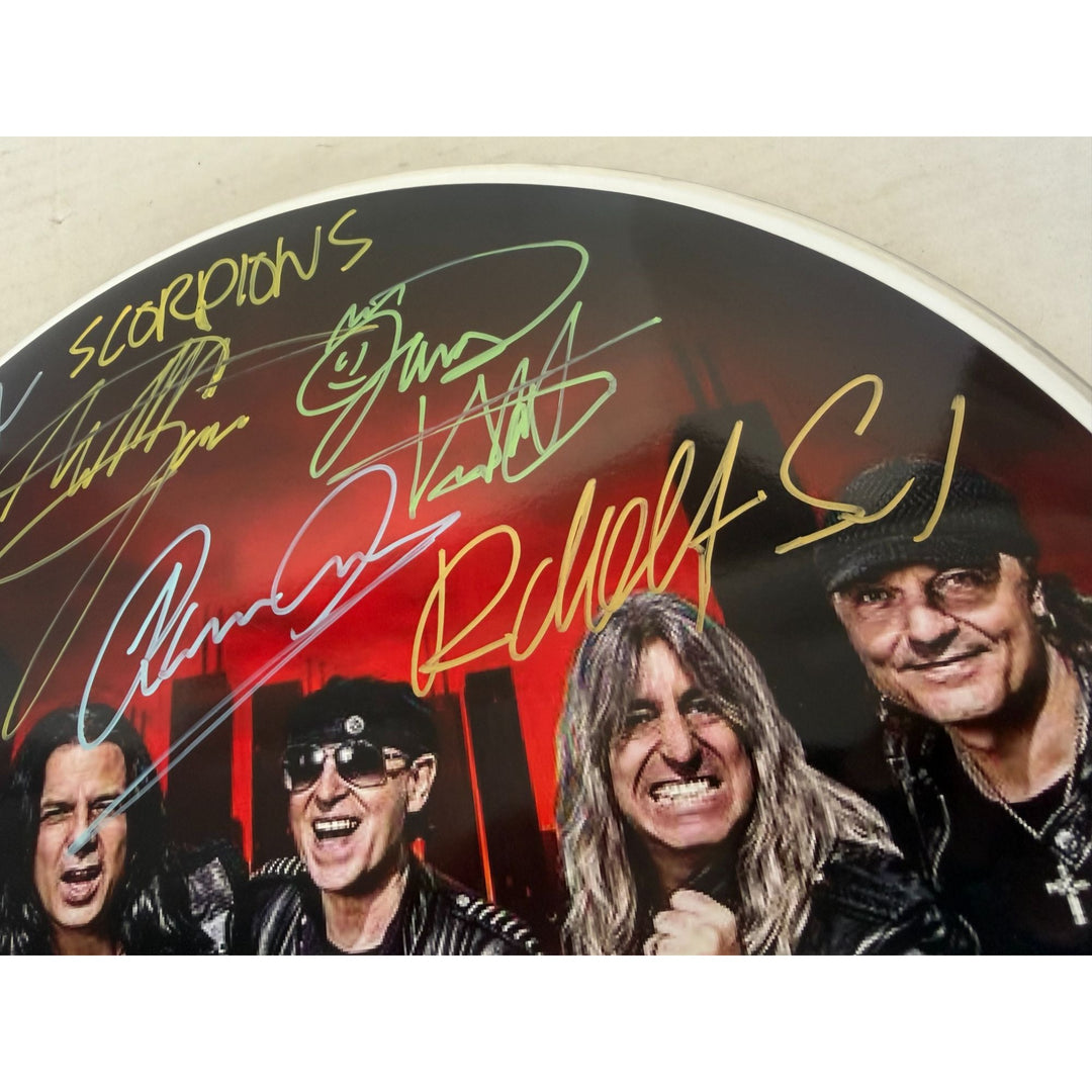 Scorpions Klaus Maine, Rudolf Schenker, Pawel Maciwoda drumhead signed with proof.