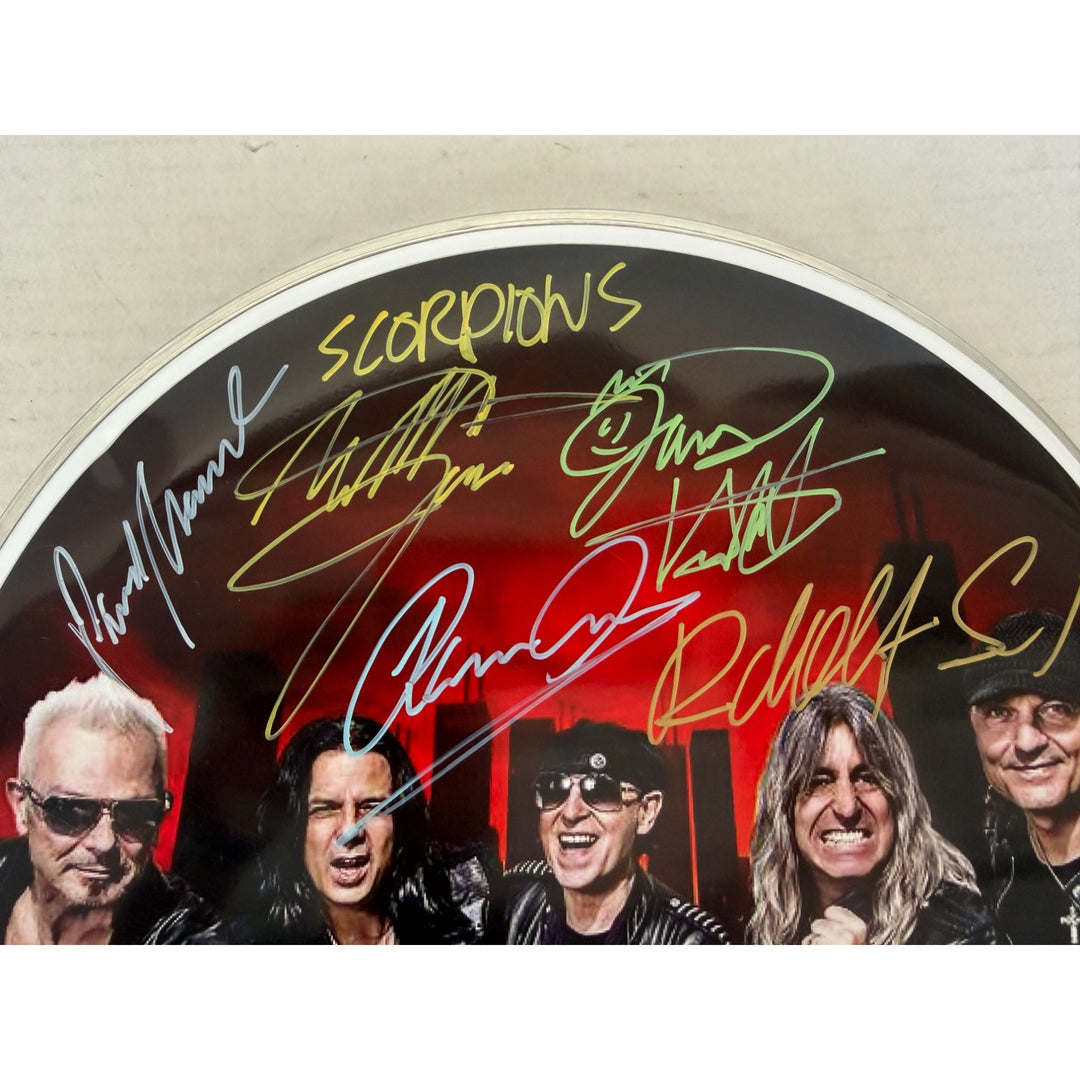 Scorpions Klaus Maine, Rudolf Schenker, Pawel Maciwoda drumhead signed with proof.