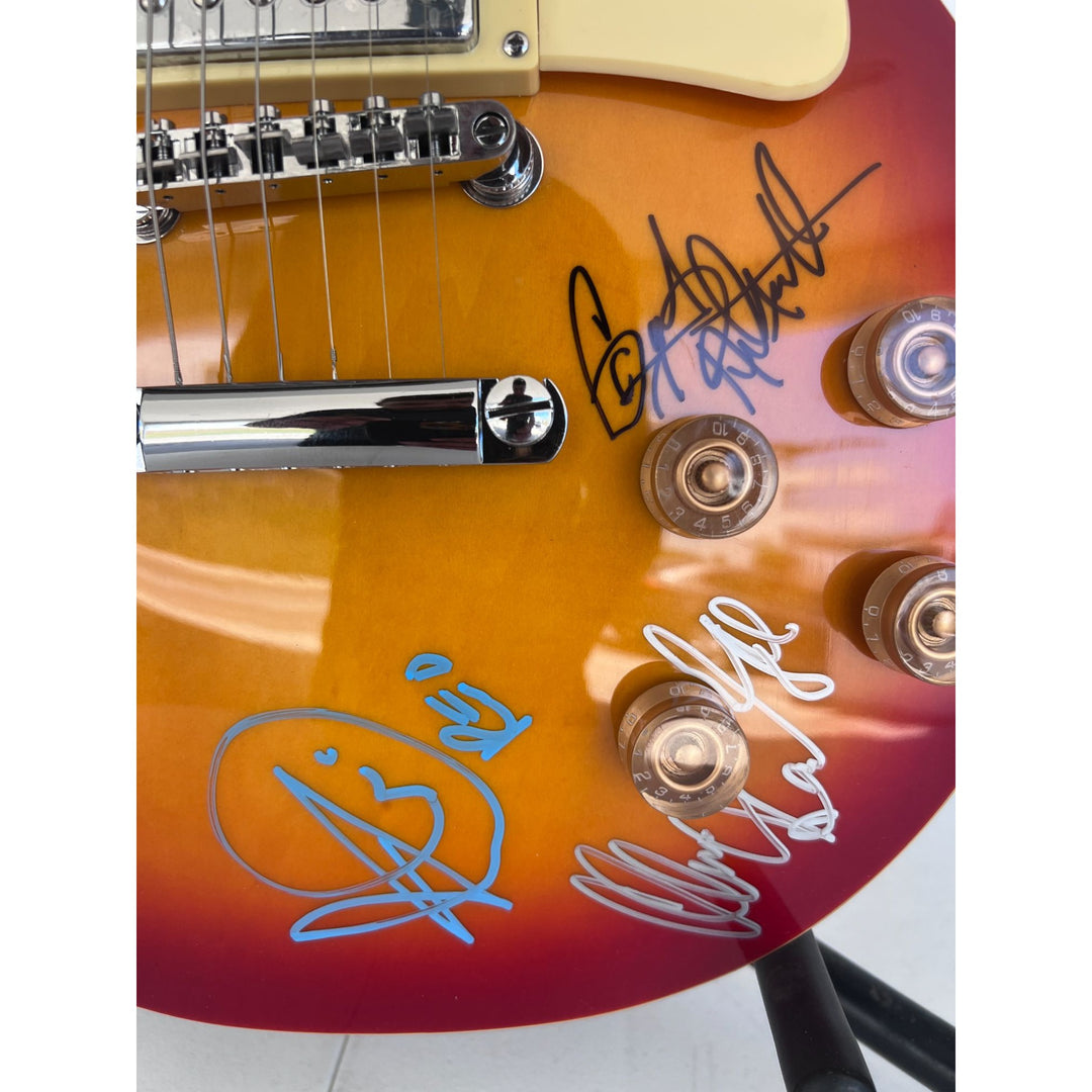 Reo Speedwagon Kevin Cronin, Dave Amato, Bruce Hall, Brian Hitt and Derek Hilland full size les paul electric guitar signed with proof.