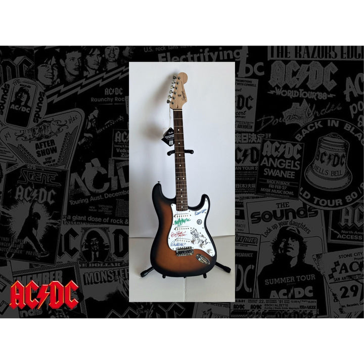 AC/DC Angus & Malcolm Young, Brian Johnston, Phil Rudd, Cliff Williams Fender Stratocaster electric guitar signed with proof