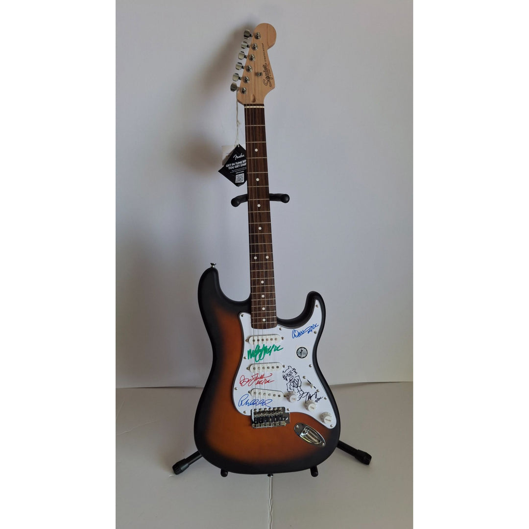 AC/DC Angus & Malcolm Young, Brian Johnston, Phil Rudd, Cliff Williams Fender Stratocaster electric guitar signed with proof