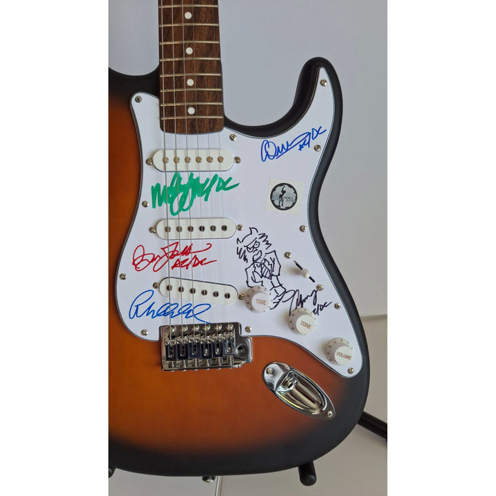 AC/DC Angus & Malcolm Young, Brian Johnston, Phil Rudd, Cliff Williams Fender Stratocaster electric guitar signed with proof
