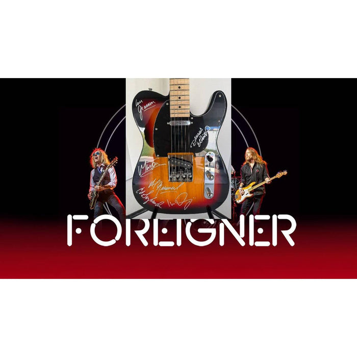 Foreigner telecaster electric guitar signed by Mick Jones, Dennis Elliott, Al Greenwood, Lou Gramm, Ian McDonald and Ed Gagliardi.