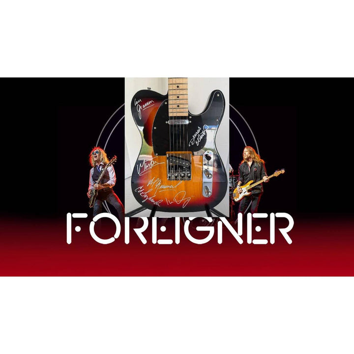 Foreigner telecaster electric guitar signed by Mick Jones, Dennis Elliott, Al Greenwood, Lou Gramm, Ian McDonald and Ed Gagliardi.