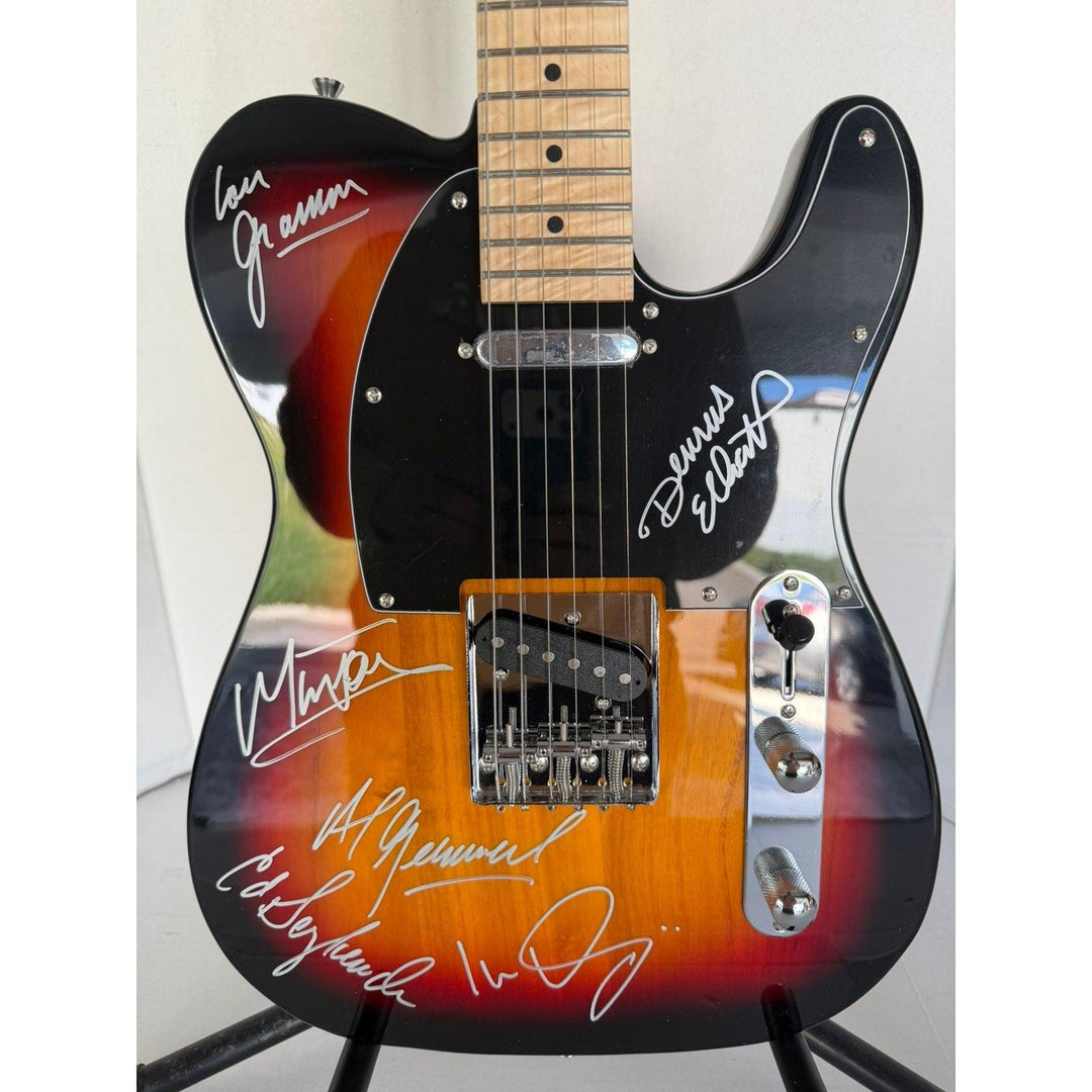 Foreigner telecaster electric guitar signed by Mick Jones, Dennis Elliott, Al Greenwood, Lou Gramm, Ian McDonald and Ed Gagliardi.