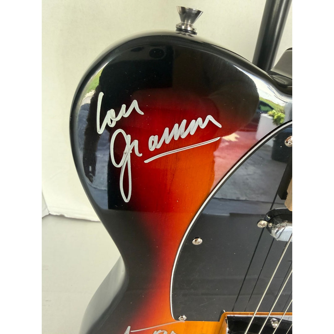 Foreigner telecaster electric guitar signed by Mick Jones, Dennis Elliott, Al Greenwood, Lou Gramm, Ian McDonald and Ed Gagliardi.