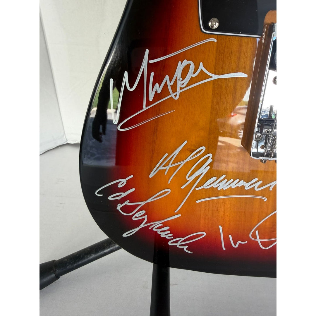 Foreigner telecaster electric guitar signed by Mick Jones, Dennis Elliott, Al Greenwood, Lou Gramm, Ian McDonald and Ed Gagliardi.
