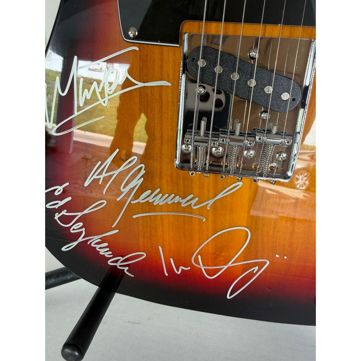 Foreigner telecaster electric guitar signed by Mick Jones, Dennis Elliott, Al Greenwood, Lou Gramm, Ian McDonald and Ed Gagliardi.