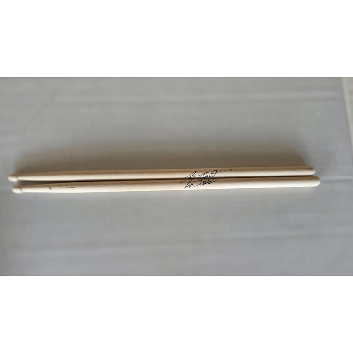 Neil Peart Rush pair of drumsticks signed with proof.
