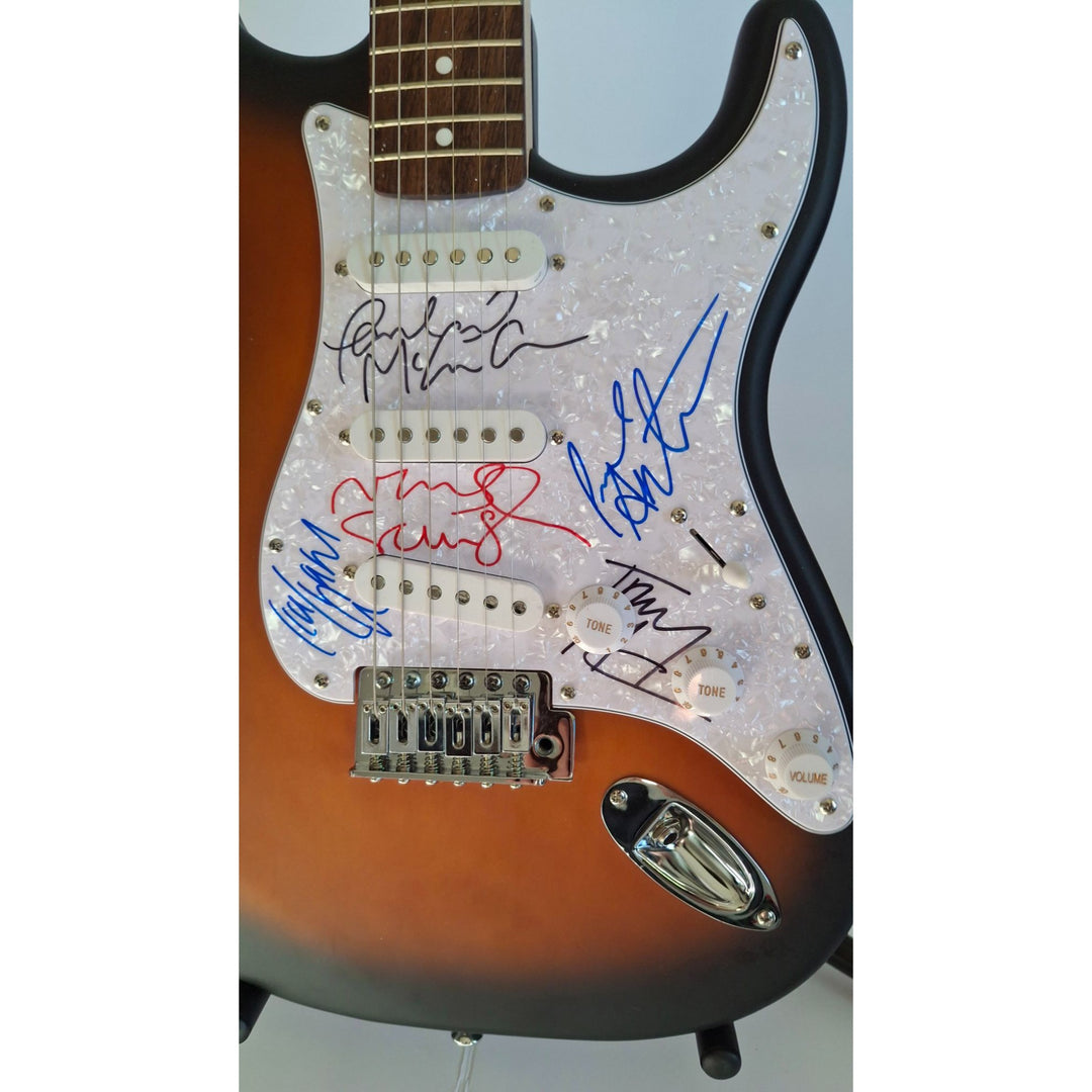 Oasis Liam & Noel Gallagher, Fender Stratocaster electric guitar signed with proof