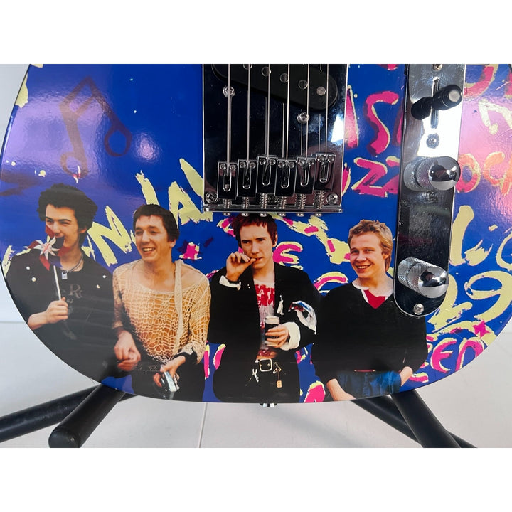 The Sex Pistols John Lyndon "Johnny Rotten", Glen Matlock, Paul Cook, Steve Jones one of a kind telecaster electric guitar signed with proof.