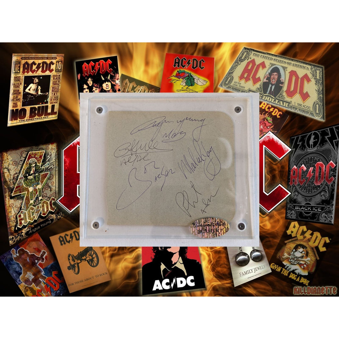 Bon Scott, Angus & Malcolm Young, Cliff Williams, Phil Rudd AC/DC Vintage autograph book page signed with proof