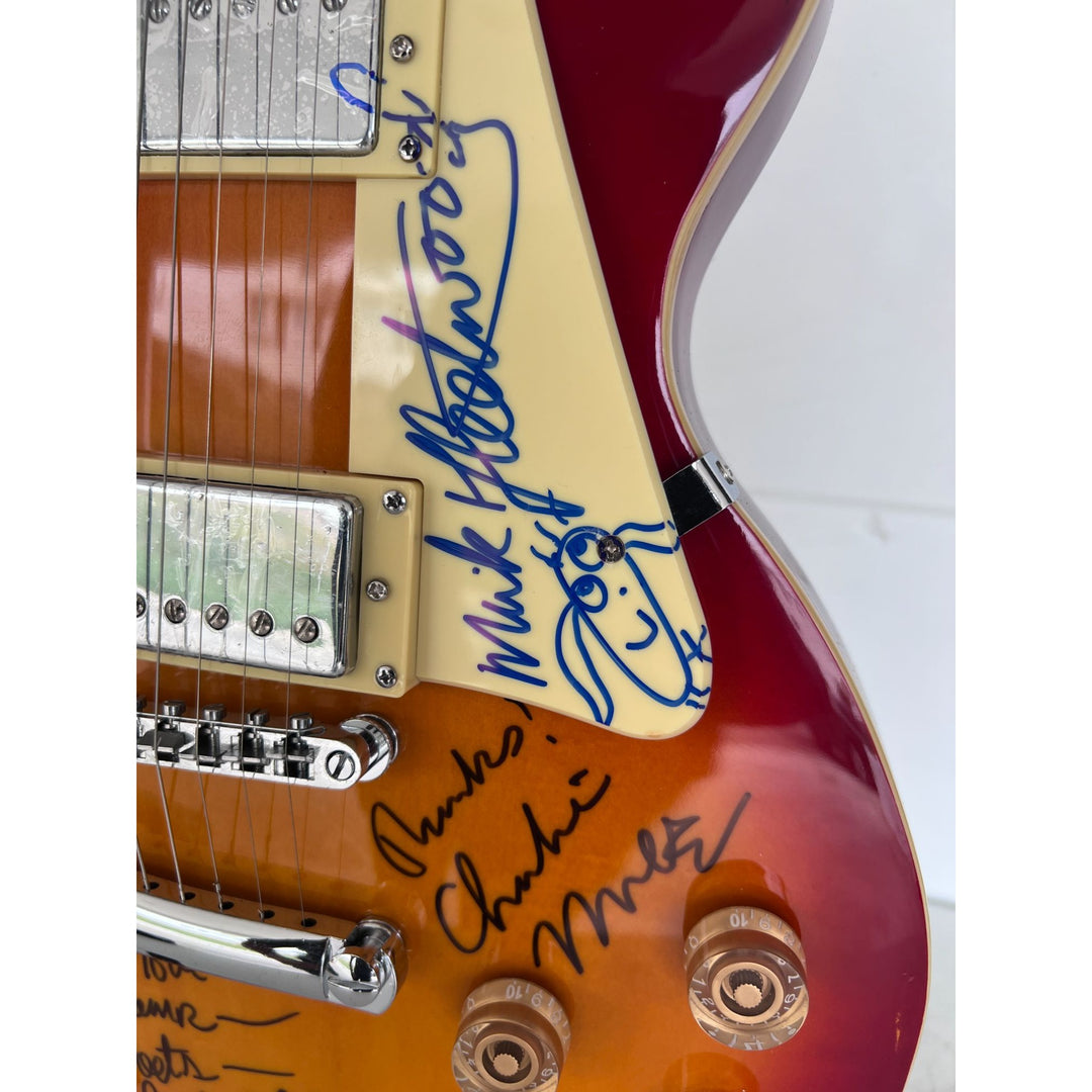 Fleetwood Mac vintage les paul signed by Mick Fleetwood, Christine McVie, John McVie, Stevie Nicks and Lindsey Buckingham signed with proof.