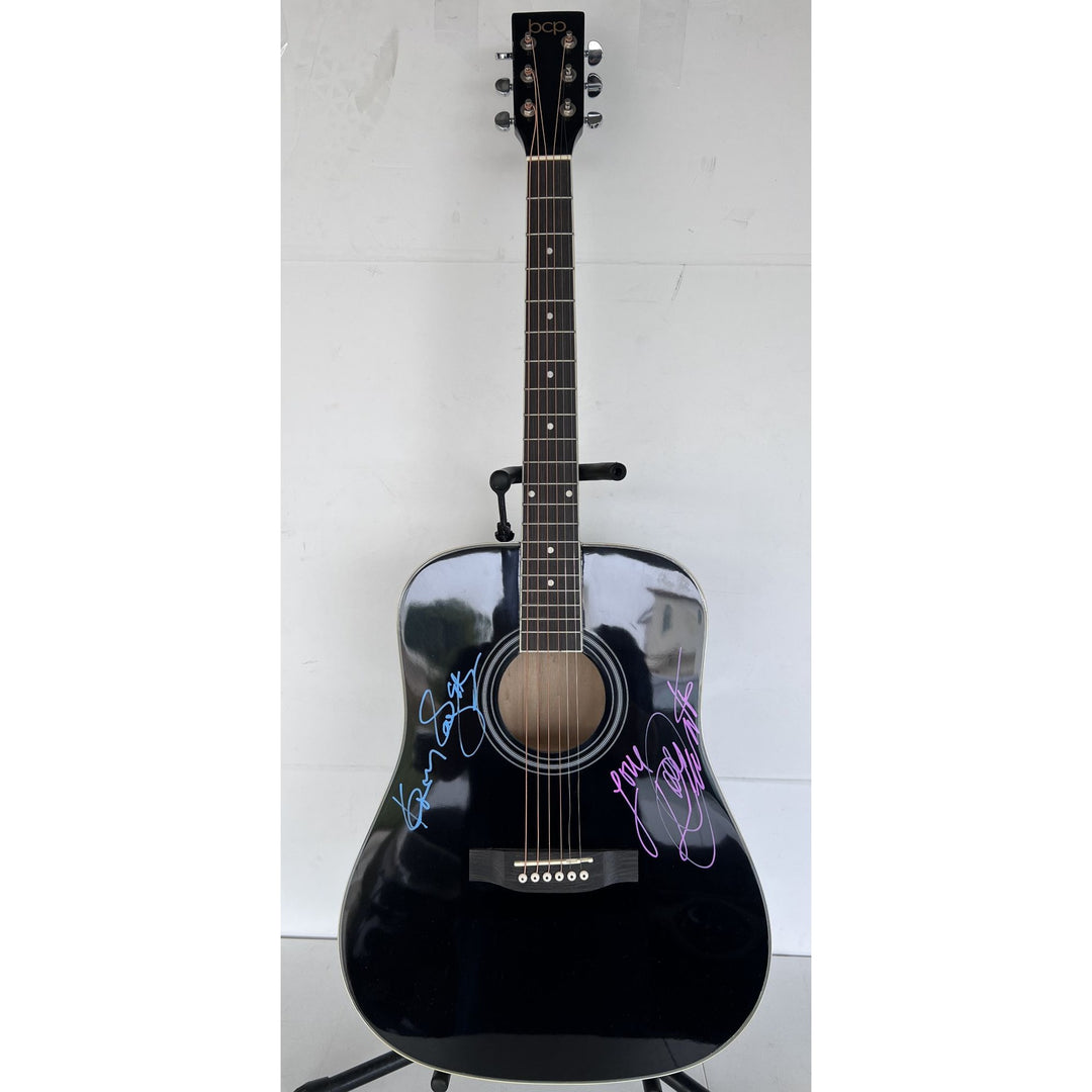 Dolly Parton and Kenny Rogers full size acoustic guitar signed with proof.