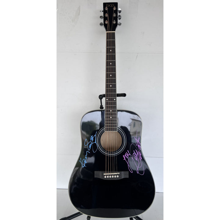 Dolly Parton and Kenny Rogers full size acoustic guitar signed with proof.