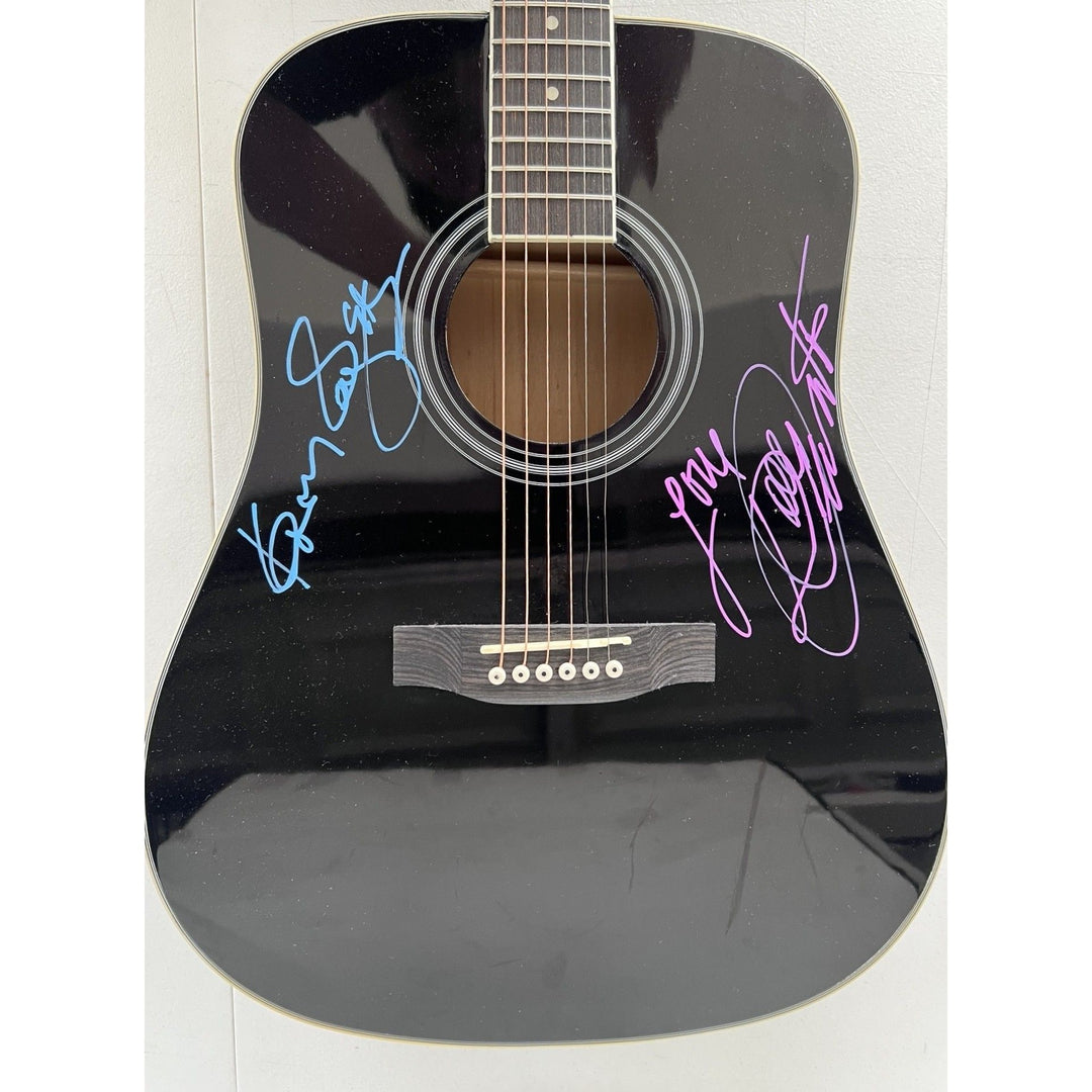 Dolly Parton and Kenny Rogers full size acoustic guitar signed with proof.