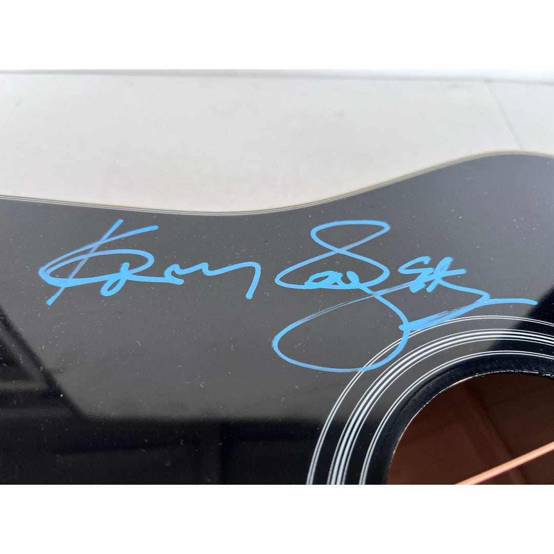 Dolly Parton and Kenny Rogers full size acoustic guitar signed with proof.