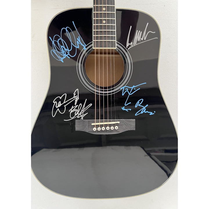U2 Irish rock band Bono, the Edge, Adam Clayton, and Larry Mullen Jr. full size acoustic guitar signed with proof.