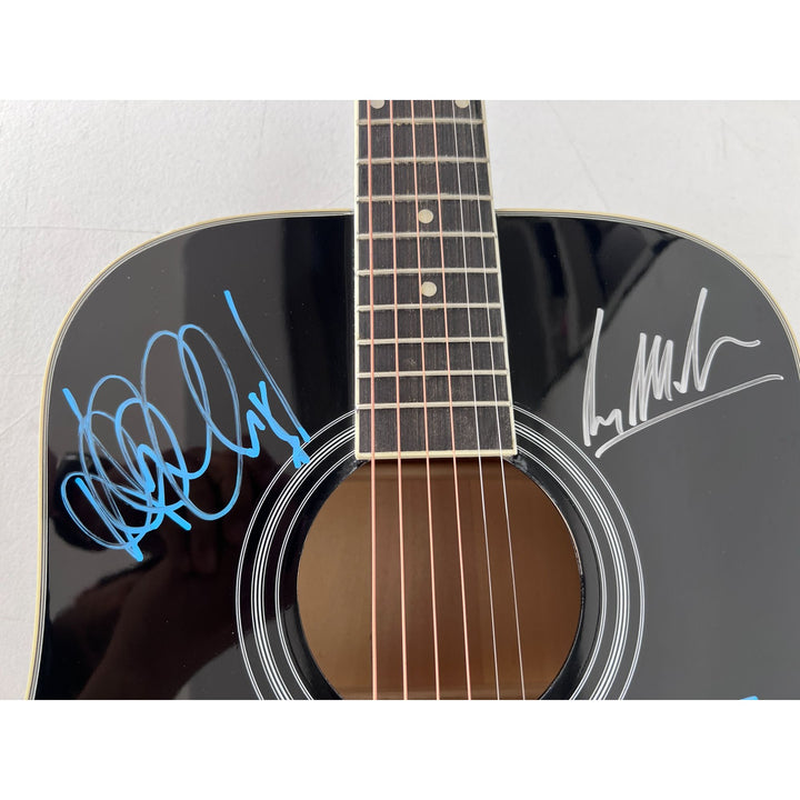 U2 Irish rock band Bono, the Edge, Adam Clayton, and Larry Mullen Jr. full size acoustic guitar signed with proof.