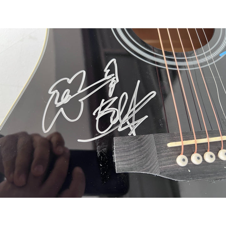 U2 Irish rock band Bono, the Edge, Adam Clayton, and Larry Mullen Jr. full size acoustic guitar signed with proof.