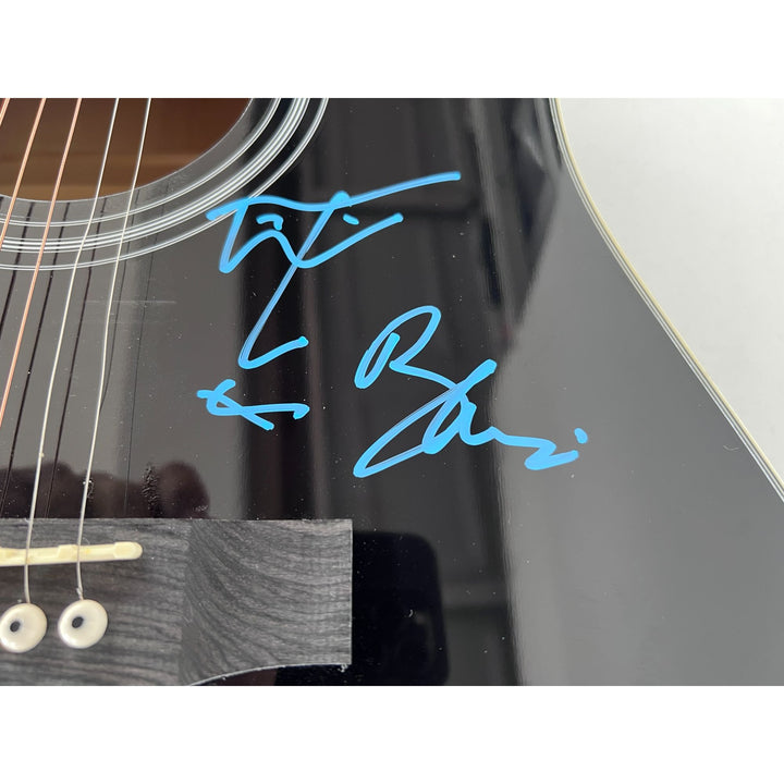U2 Irish rock band Bono, the Edge, Adam Clayton, and Larry Mullen Jr. full size acoustic guitar signed with proof.