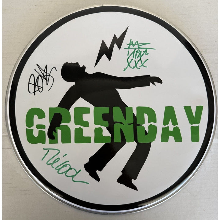 Green Day Billie Joe Armstrong Tré Cool 10-in one-of-a-kind drumhead signed with proof.