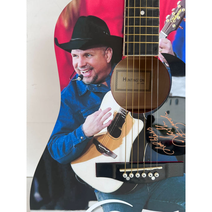 Garth Brooks full size acoustic guitar (one of a kind ) signed with proof.
