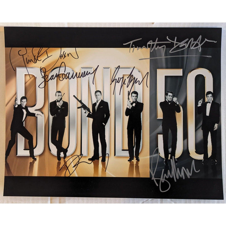 James Bond 007, Sean Connery, Roger Moore, Daniel Craig, Pierce Brosnan, Timothy Dalton, George Lazenby 11x14 photo signed with proof