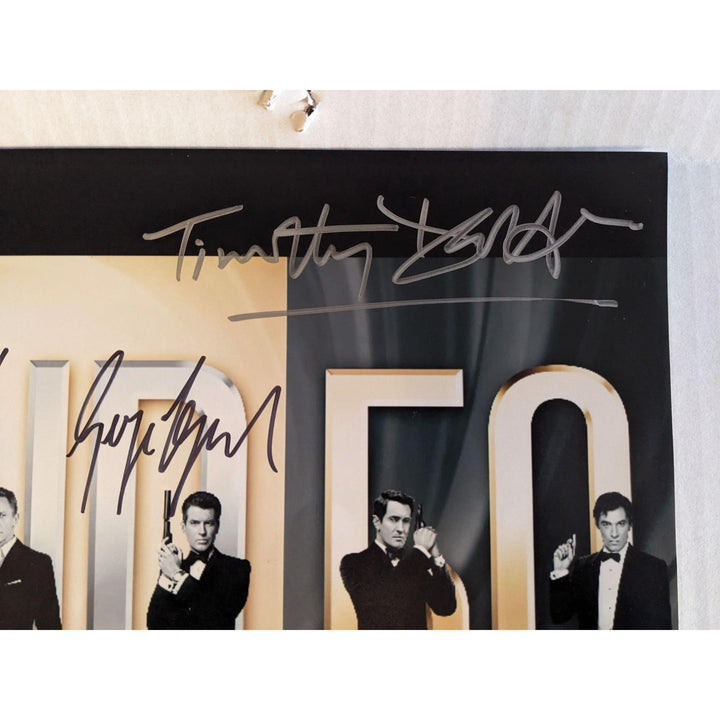 James Bond 007, Sean Connery, Roger Moore, Daniel Craig, Pierce Brosnan, Timothy Dalton, George Lazenby 11x14 photo signed with proof
