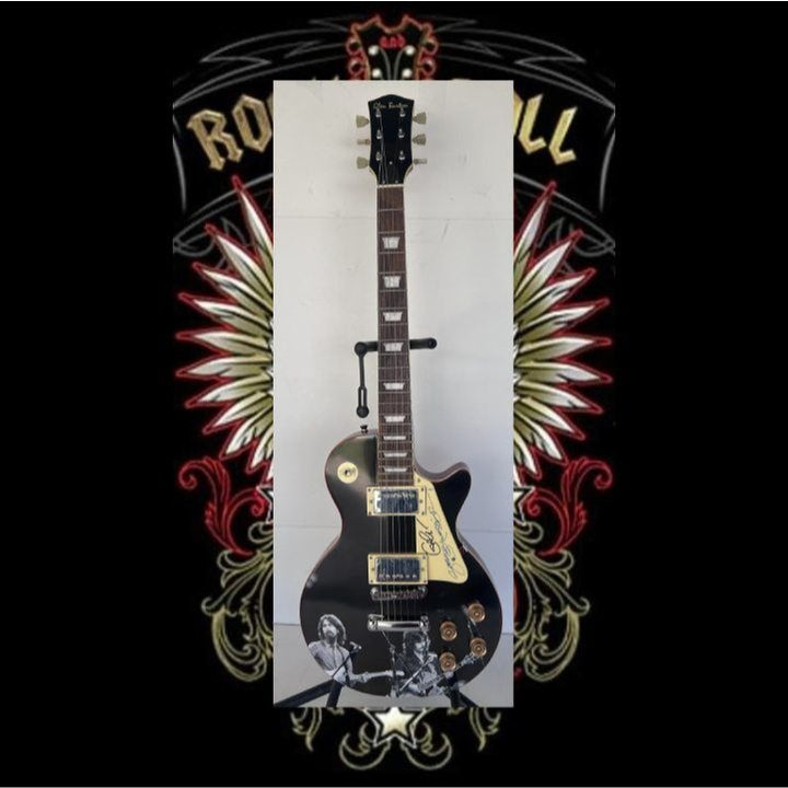 George Harrison and Eric Clapton  one of a kind les paul (full size) electric guitar signed with proof.