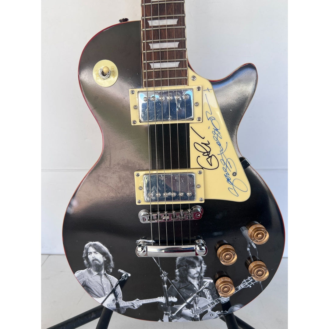 George Harrison and Eric Clapton  one of a kind les paul (full size) electric guitar signed with proof.