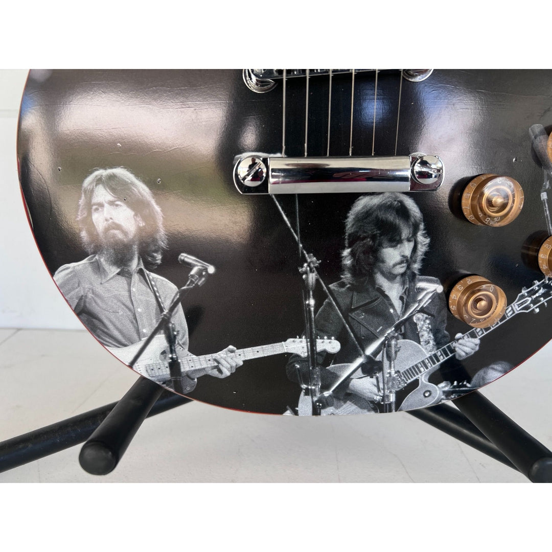 George Harrison and Eric Clapton  one of a kind les paul (full size) electric guitar signed with proof.