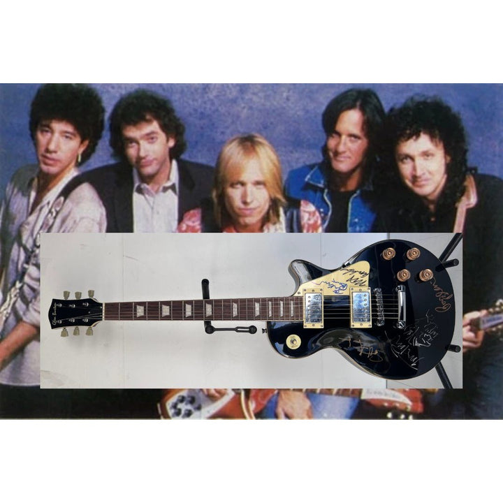 Tom Petty signed with sketch and the Heartbreakers vintage les paul full size electric guitar signed with proof.