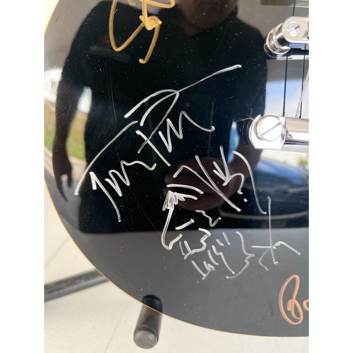 Tom Petty signed with sketch and the Heartbreakers vintage les paul full size electric guitar signed with proof.