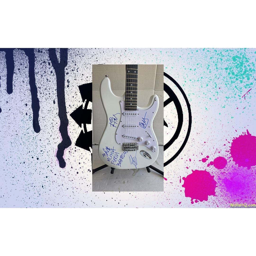 Travis Barker, Mark Hoppus, Tom De Longe, Blink 182, authentic Fender Stratocaster electric guitar signed with proof.