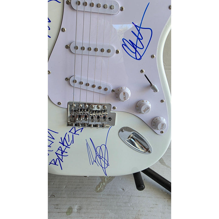 Travis Barker, Mark Hoppus, Tom De Longe, Blink 182, authentic Fender Stratocaster electric guitar signed with proof.