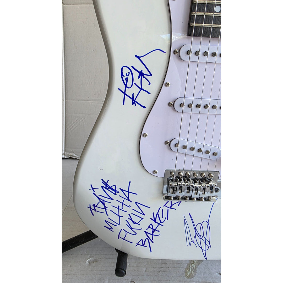 Travis Barker, Mark Hoppus, Tom De Longe, Blink 182, authentic Fender Stratocaster electric guitar signed with proof.