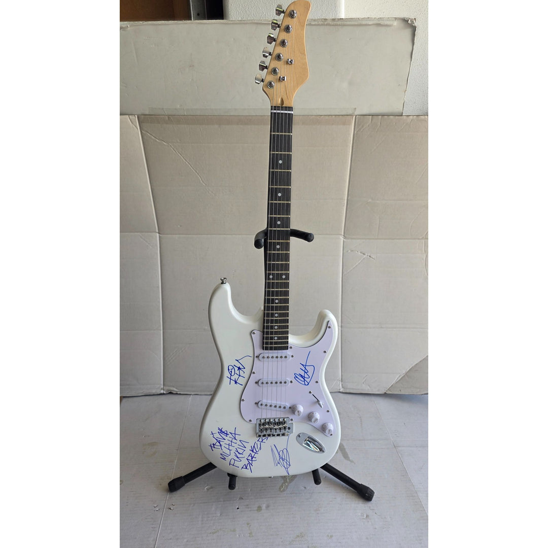 Travis Barker, Mark Hoppus, Tom De Longe, Blink 182, authentic Fender Stratocaster electric guitar signed with proof.