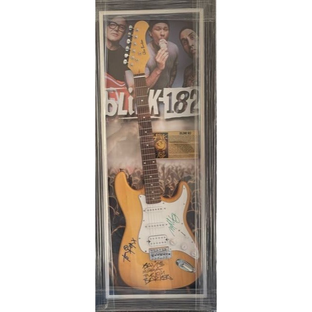 Travis Barker, Mark Hoppus, Tom De Longe, Blink 182, authentic Fender Stratocaster electric guitar signed with proof.