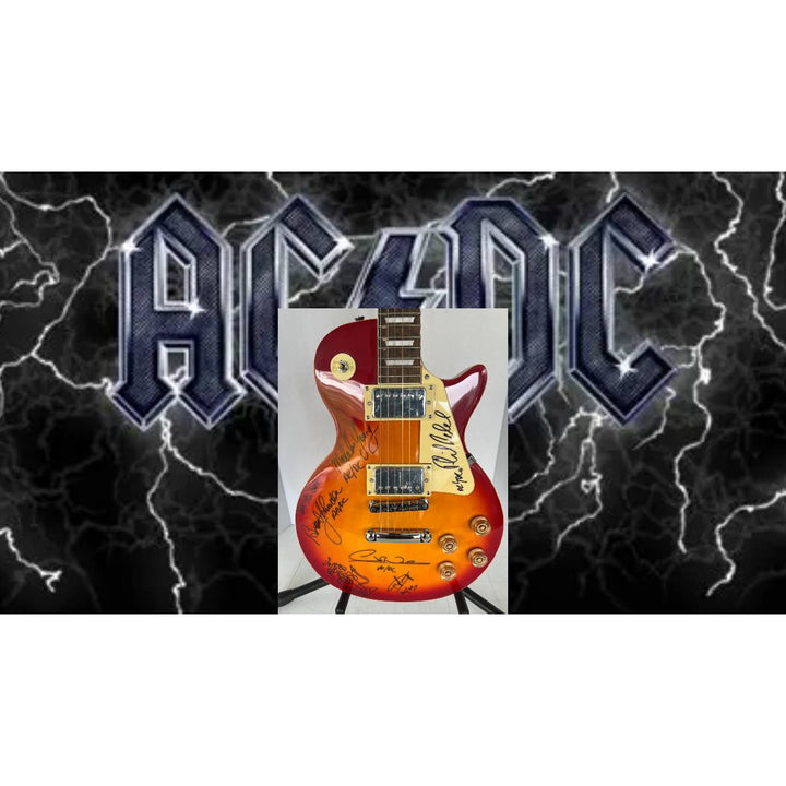 ACDC Angus Young, Malcolm Young, Phil Rudd, Brian Johnston, Cliff Williams les paul electric guitar signed with proof
