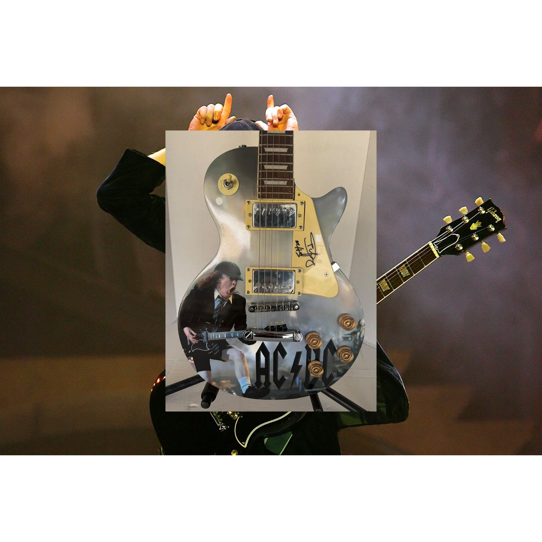 Angus Young AC/DC One of a Kind full size les paul electric guitar signed with proof.