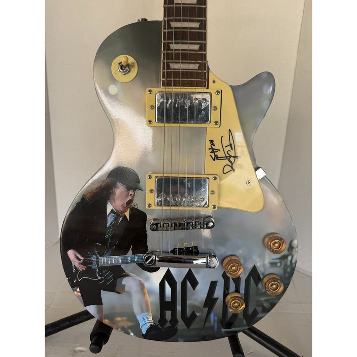 Angus Young AC/DC One of a Kind full size les paul electric guitar signed with proof.