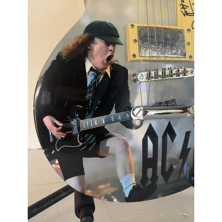 Angus Young AC/DC One of a Kind full size les paul electric guitar signed with proof.