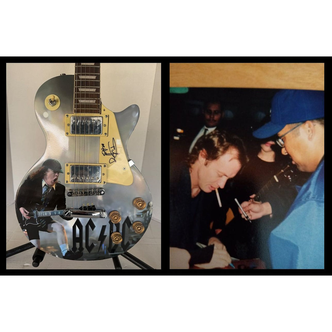 Angus Young AC/DC One of a Kind full size les paul electric guitar signed with proof.