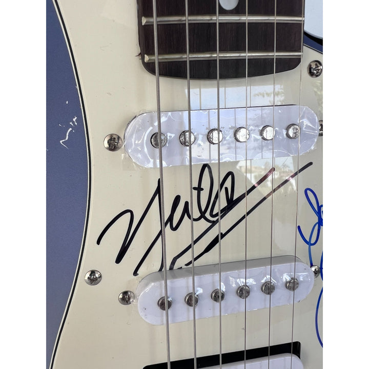 Pat Benatar and Neil Giraldo.(one of a kind) stratocaster full size electric guitar signed with proof $2995.