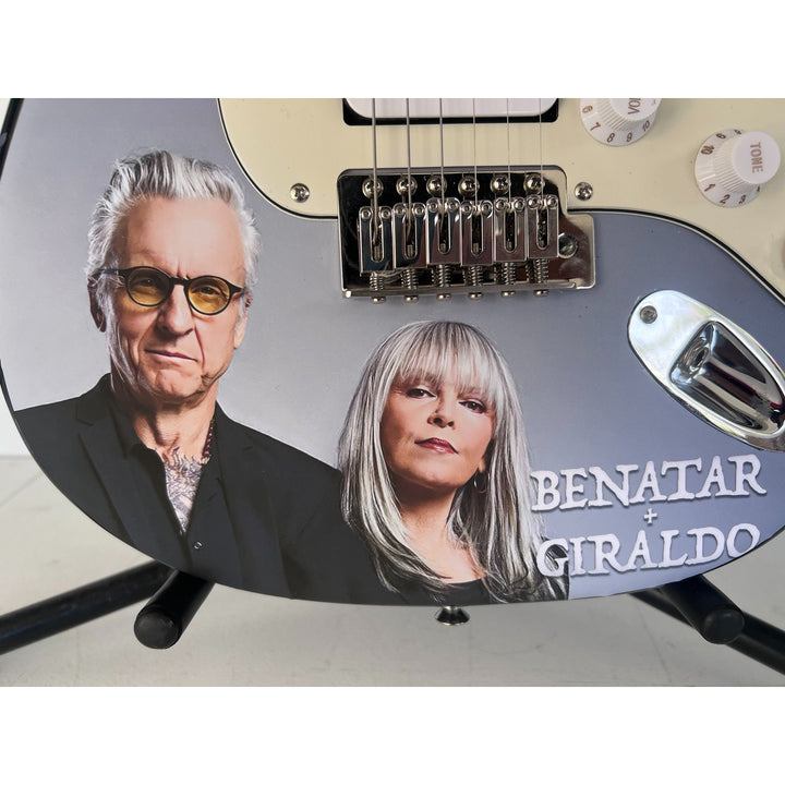 Pat Benatar and Neil Giraldo.(one of a kind) stratocaster full size electric guitar signed with proof $2995.