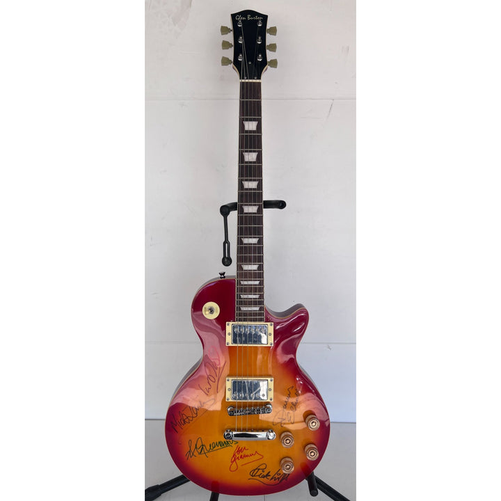Lou Gramm, Dennis Elliott, Al Greenwood, Ian McDonald, Mick Jones, and Rick Wills vintage Les Paul full size electric guitar signed.