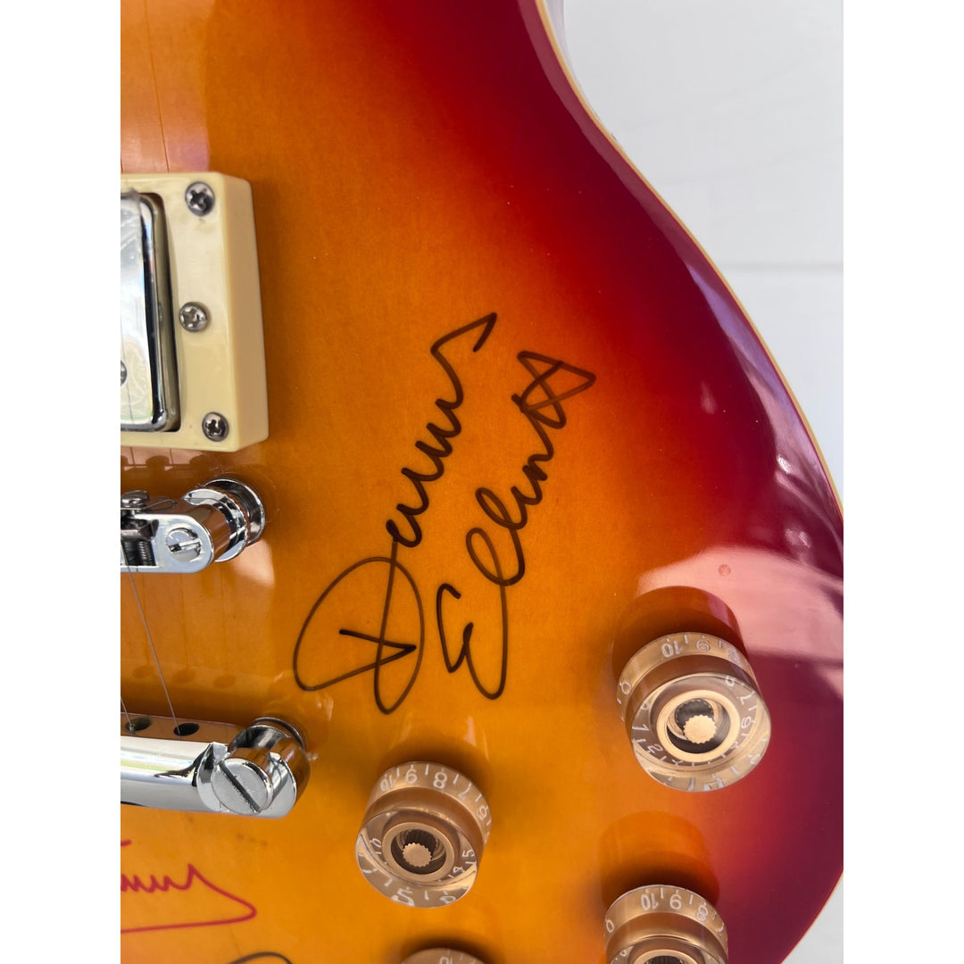 Lou Gramm, Dennis Elliott, Al Greenwood, Ian McDonald, Mick Jones, and Rick Wills vintage Les Paul full size electric guitar signed.