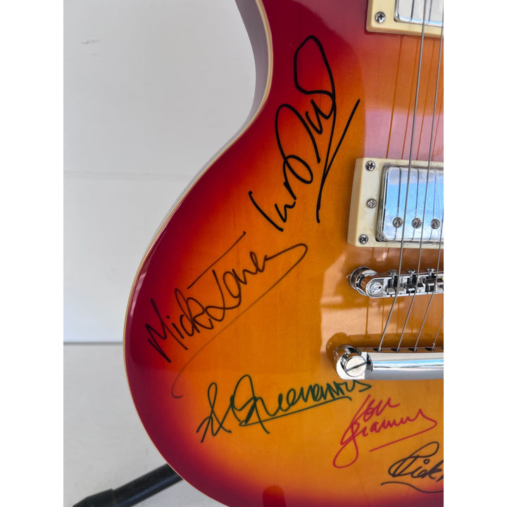Lou Gramm, Dennis Elliott, Al Greenwood, Ian McDonald, Mick Jones, and Rick Wills vintage Les Paul full size electric guitar signed.